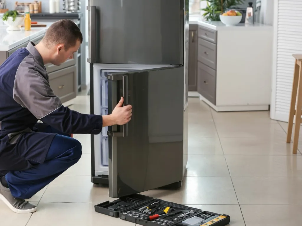 Get your fridge fixed fast in Durban! technician fixes fridge