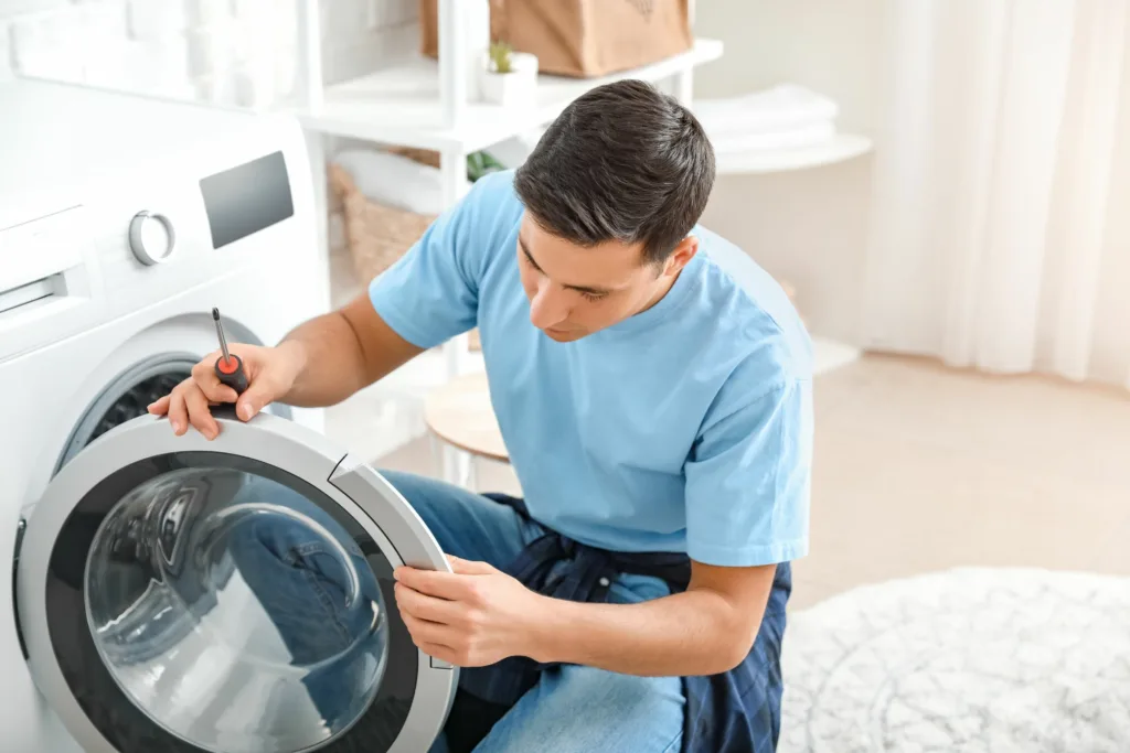 Expert repairing a broken Samsung washing machine in Pinetown, South Africa