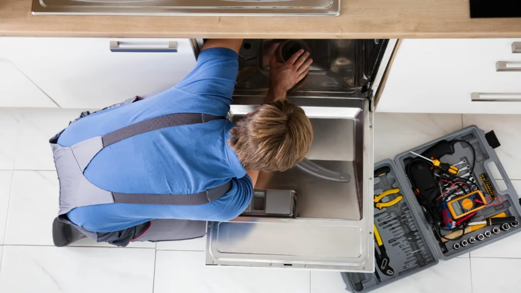 A technician is repairing a Bosch dishwasher in Durban , performing expert appliance service