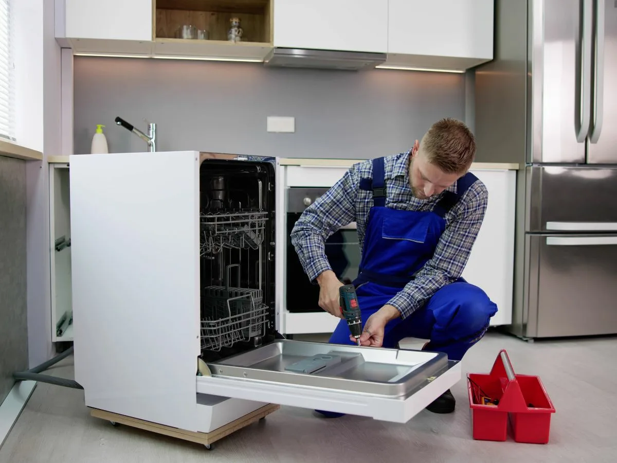 Appliance repair technician fixing a dishwasher in Umhlanga.