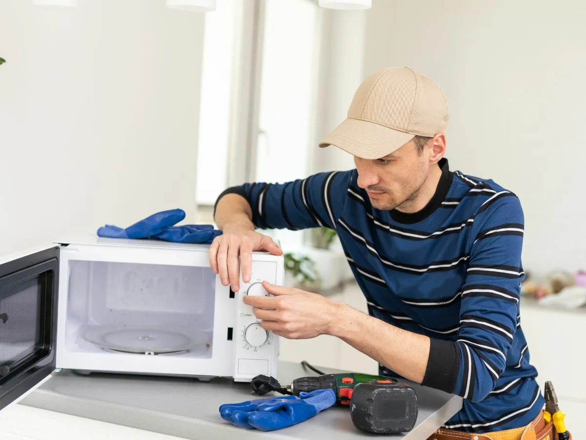 Durban North appliance repair technician fixing a microwave