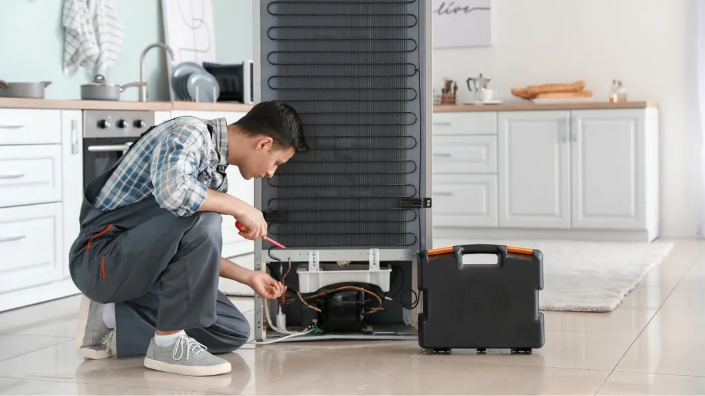 "Appliance technician examining a household appliance in a service center in Durban