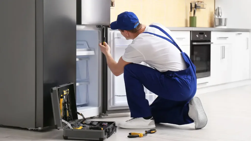 Skilled technician repairing a Samsung fridge in berea durban