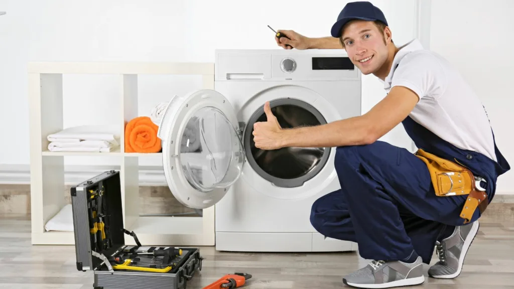technician repairing a washing machine in a Umhlanga home