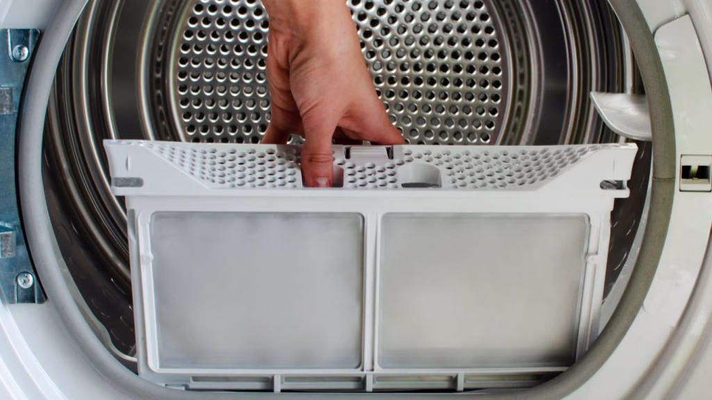 Technician fixing a tumble dryer in the Durban area