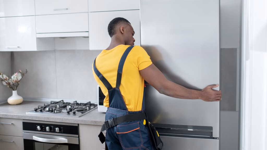 Technician providing reliable appliance repair service in a Newlands Durban kitchen