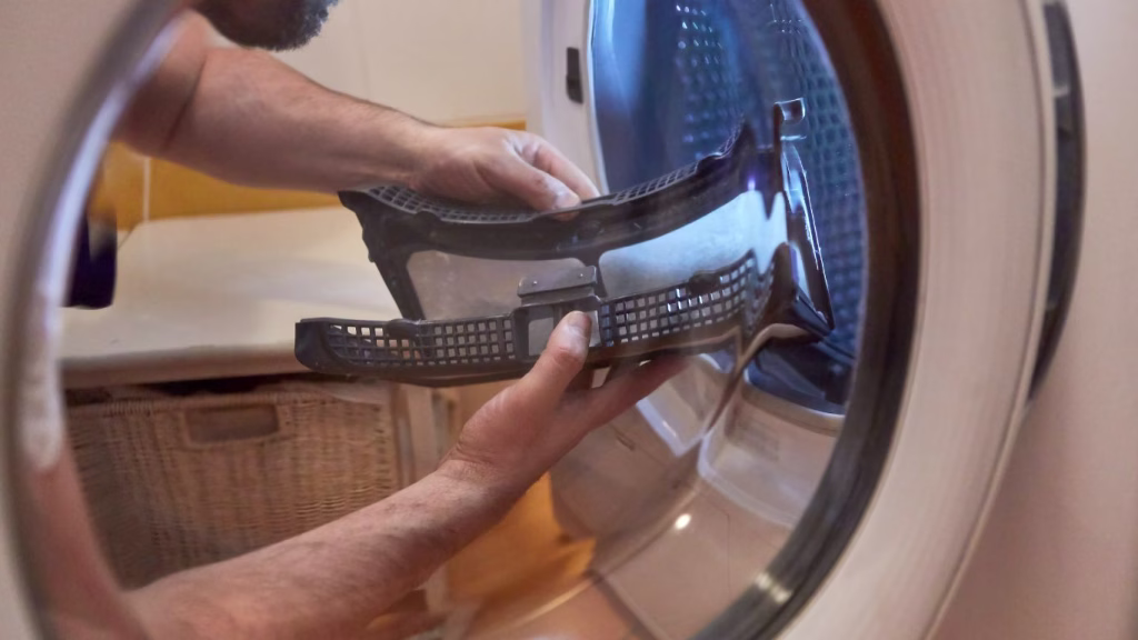Professional providing tumble dryer repairs in Berea home