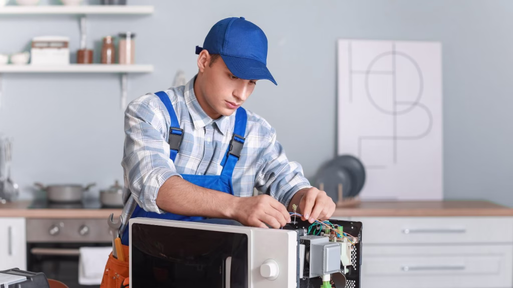 Technician repairing a Bosch microwave in Durban home