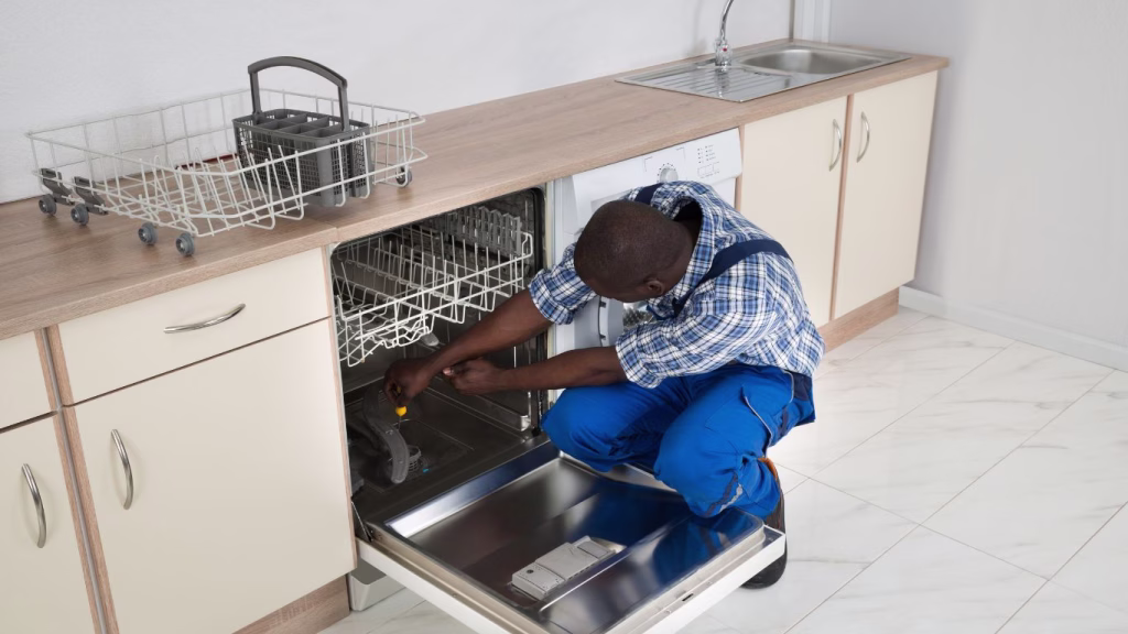 Skilled technician repairing a household appliance in a Prestondale home environment