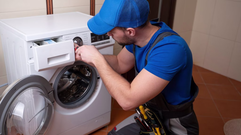 Appliance repair expert diagnosing a washing machine in a Crestholme home kitchen”