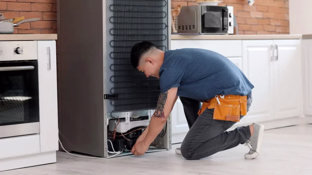 An experienced technician in Ballito working to restore a customer's Samsung fridge.