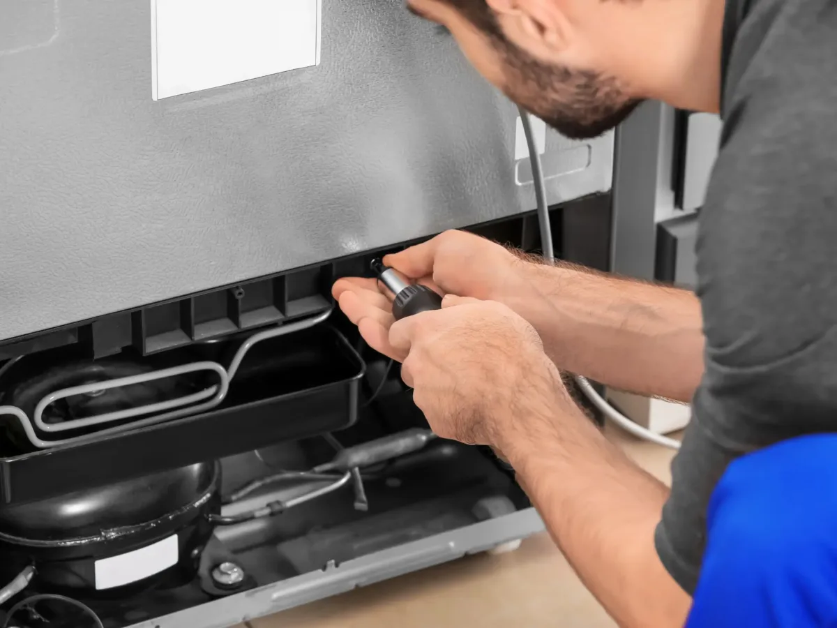 Image of a technician repairing an overheated refrigerator compressor in Verulam